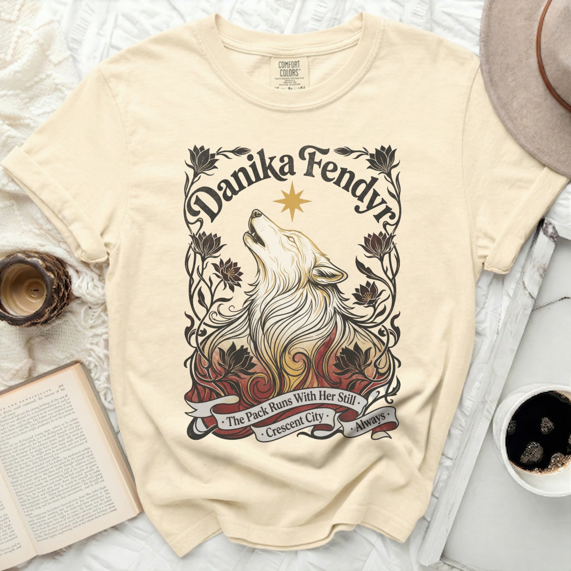Cream t-shirt with wolf artwork and "Crescent City" text.