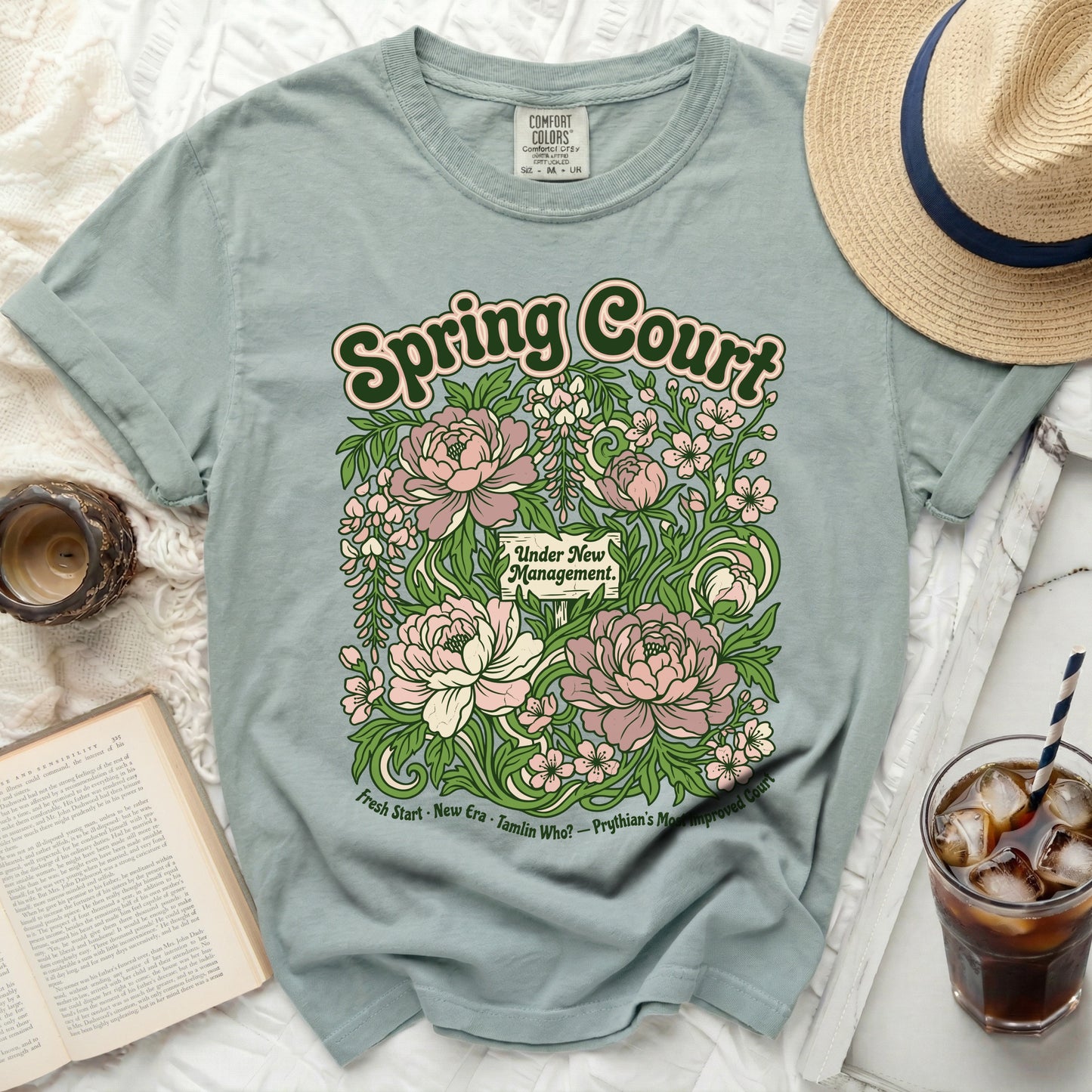 Spring Court t-shirt with floral design and text "Under New Management."