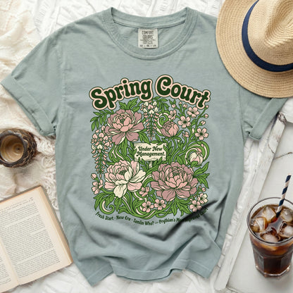Spring Court t-shirt with floral design and text "Under New Management."