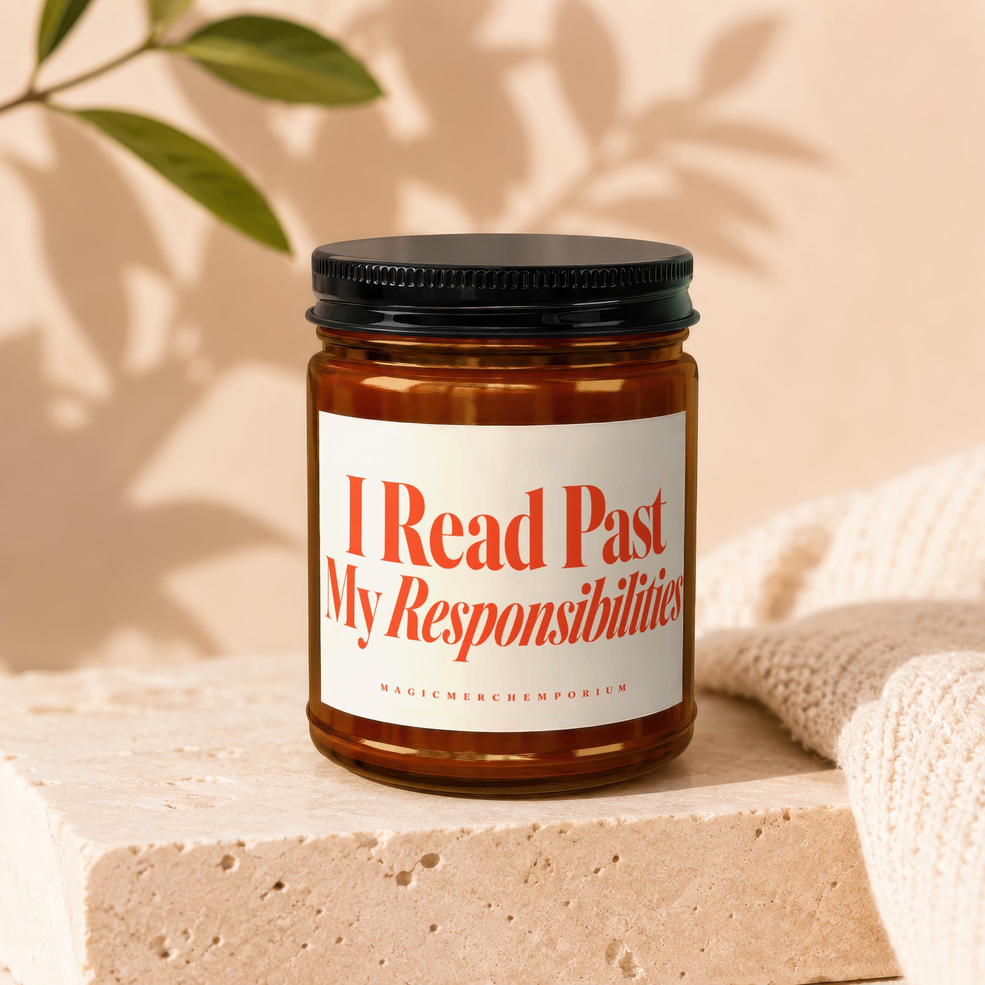 Glass candle with red text "I Read Past My Responsibilities" and "MAGICMERCHEMPORIUM".