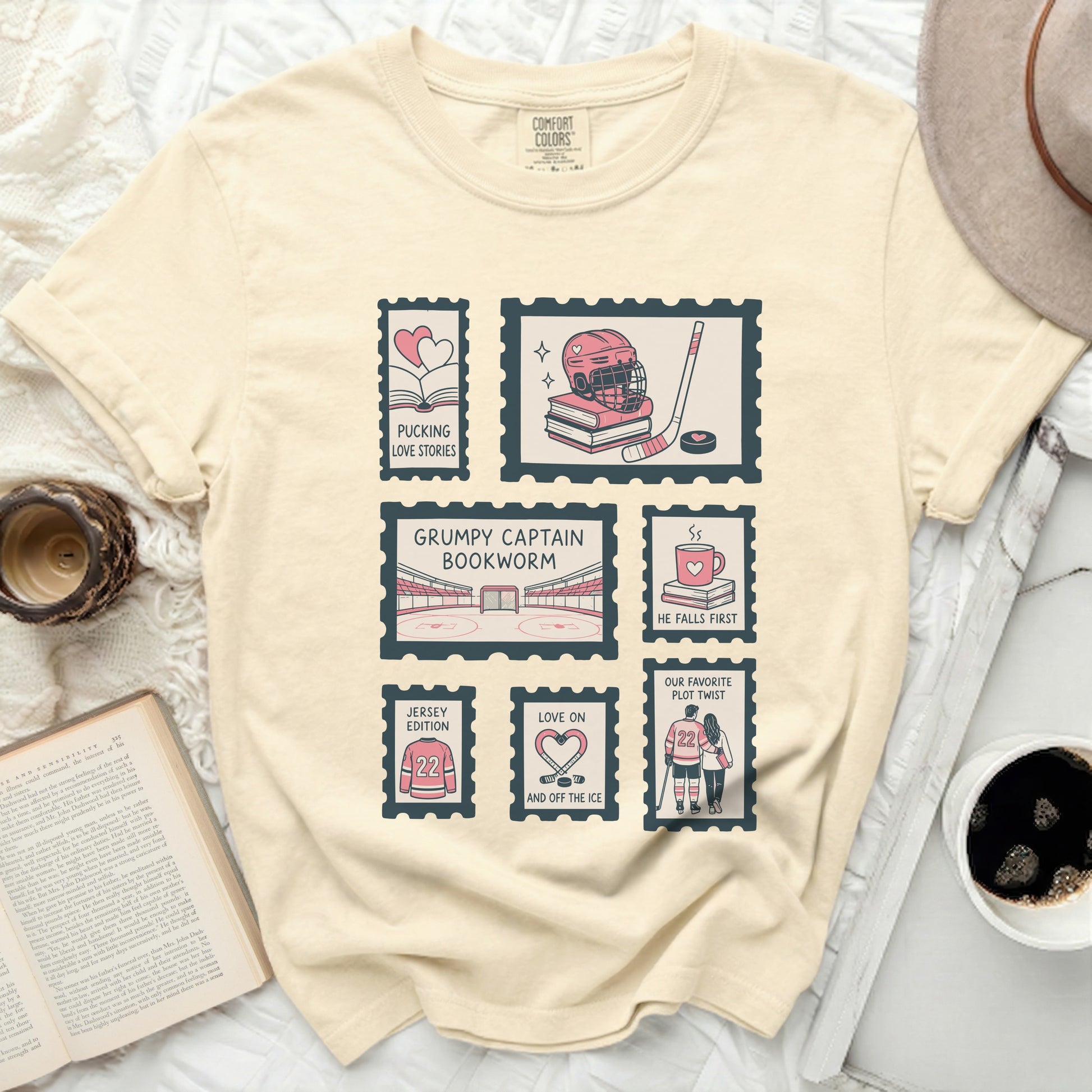 T-shirt with postage stamp designs featuring hockey and book themes.