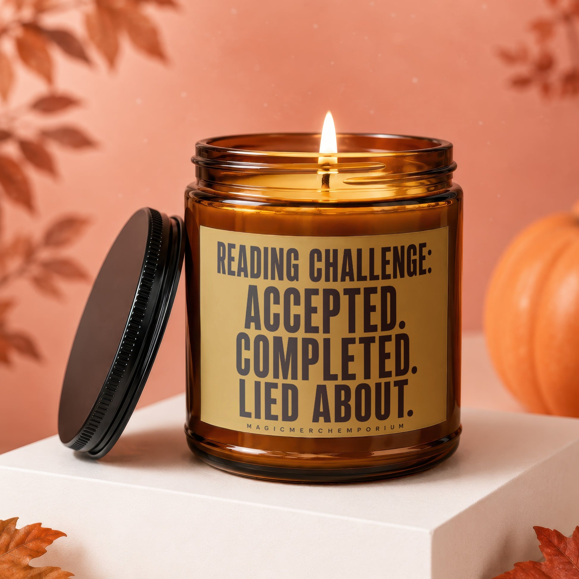 Amber candle with lid off, reading "Reading Challenge: Accepted. Completed. Lied About."