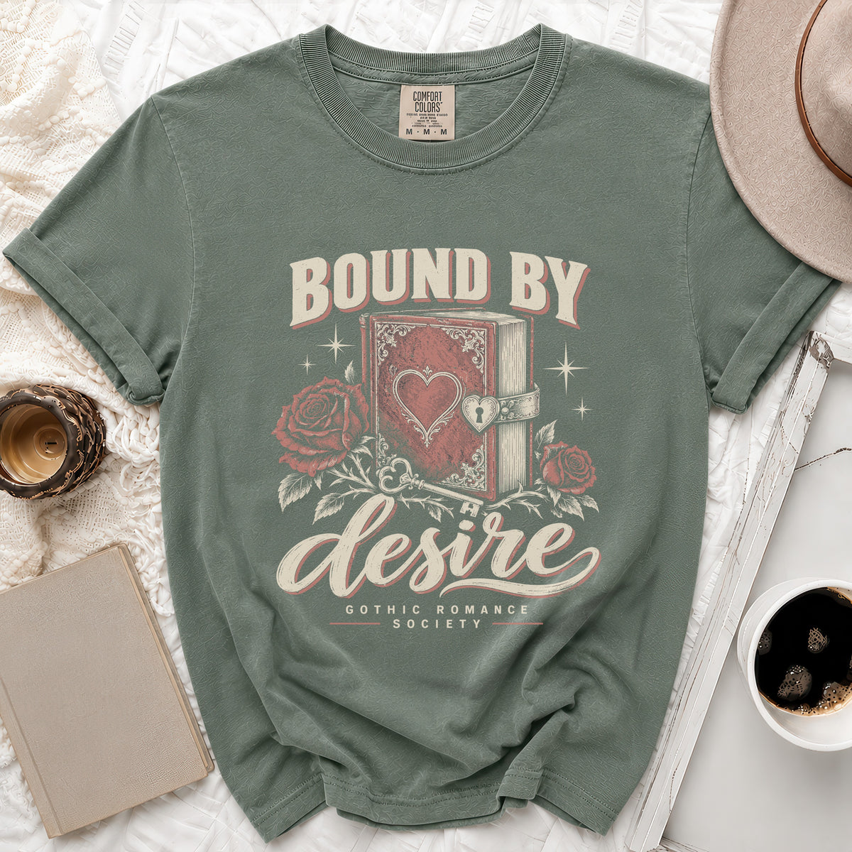 Green t-shirt with "Bound by Desire Gothic Romance Society" graphic.
