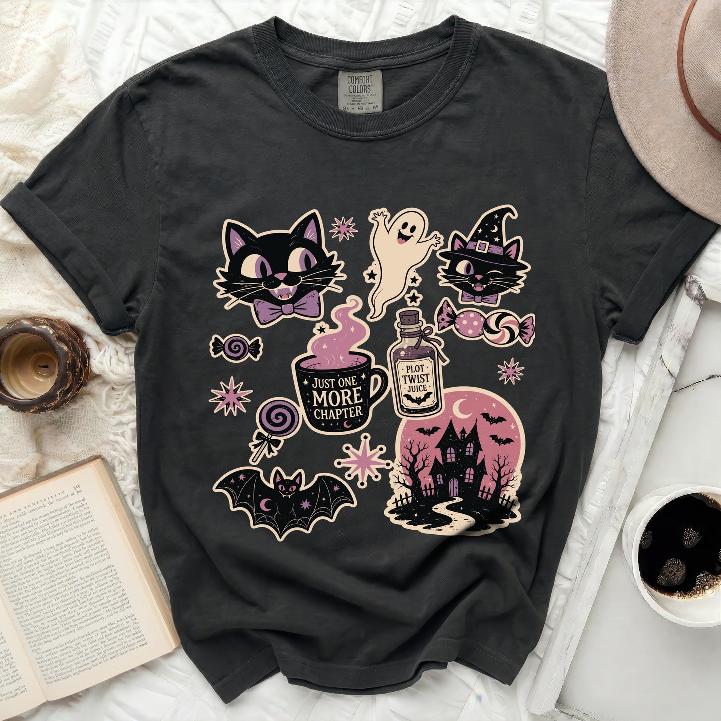 Dark gray t-shirt with Halloween graphic designs: cats, ghost, haunted house, and text.