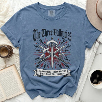 Blue t-shirt with "The Three Valkyries" text and swords graphic.