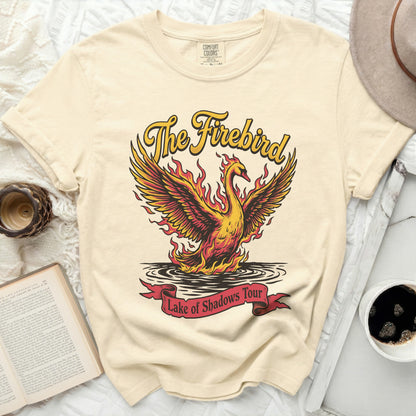 Cream t-shirt with "The Firebird" text and a fiery bird over water.