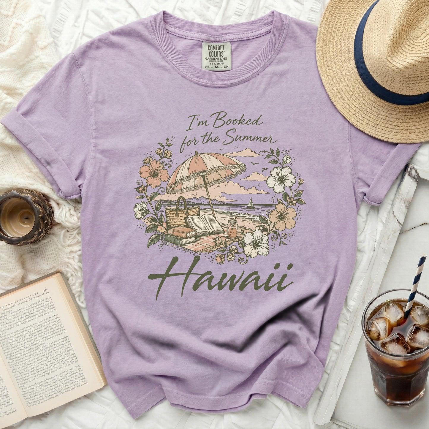 Purple t-shirt with "I'm Booked for the Summer Hawaii" beach scene graphic.