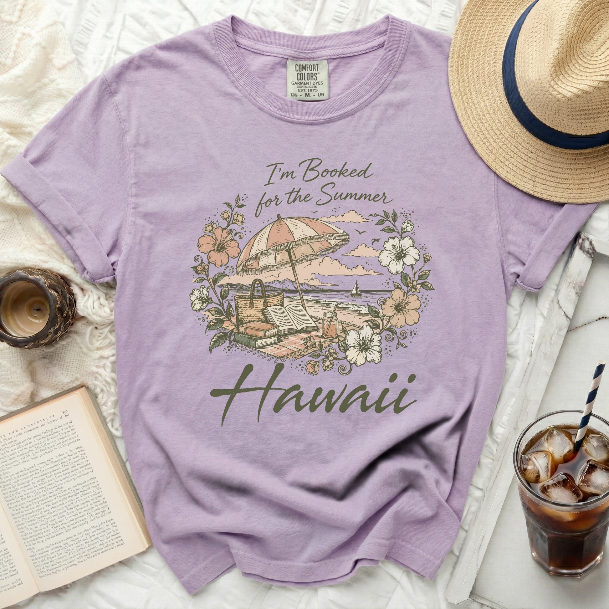Purple t-shirt with "I'm Booked for the Summer Hawaii" beach scene graphic.