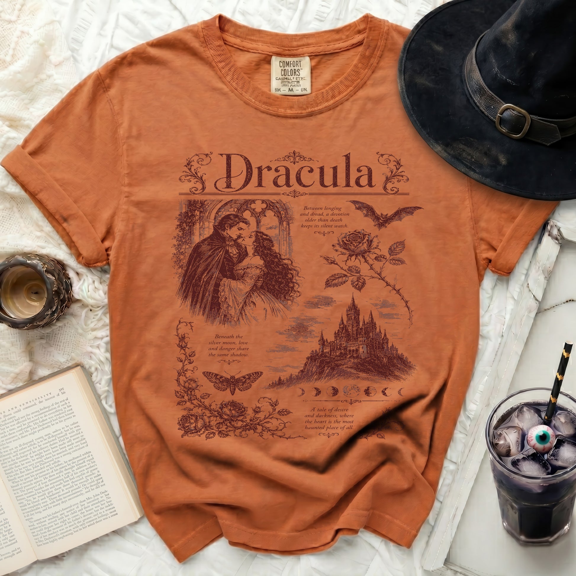 Orange t-shirt with "Dracula" graphic art, castle, bats, and quotes.