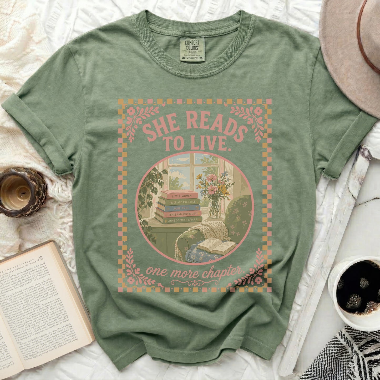 Green t-shirt with "SHE READS TO LIVE" and "one more chapter" text.