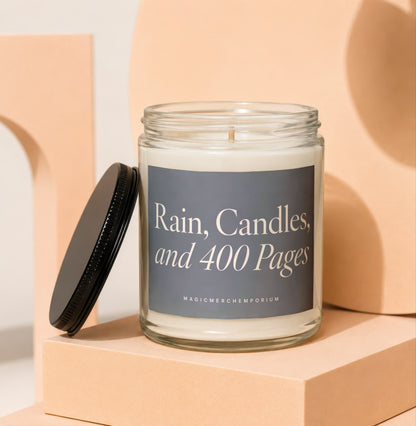 Glass candle with gray label reading "Rain, Candles, and 400 Pages"