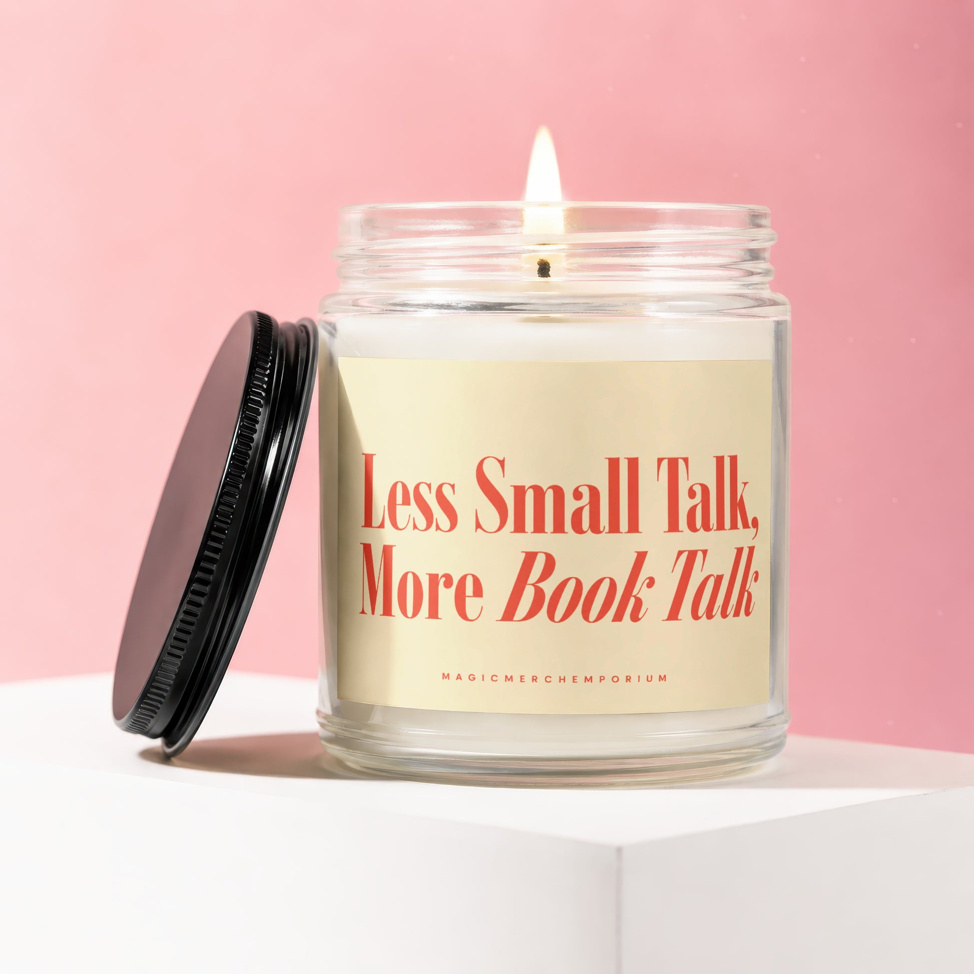 Scented candle with text "Less Small Talk, More Book Talk" on a light yellow label.