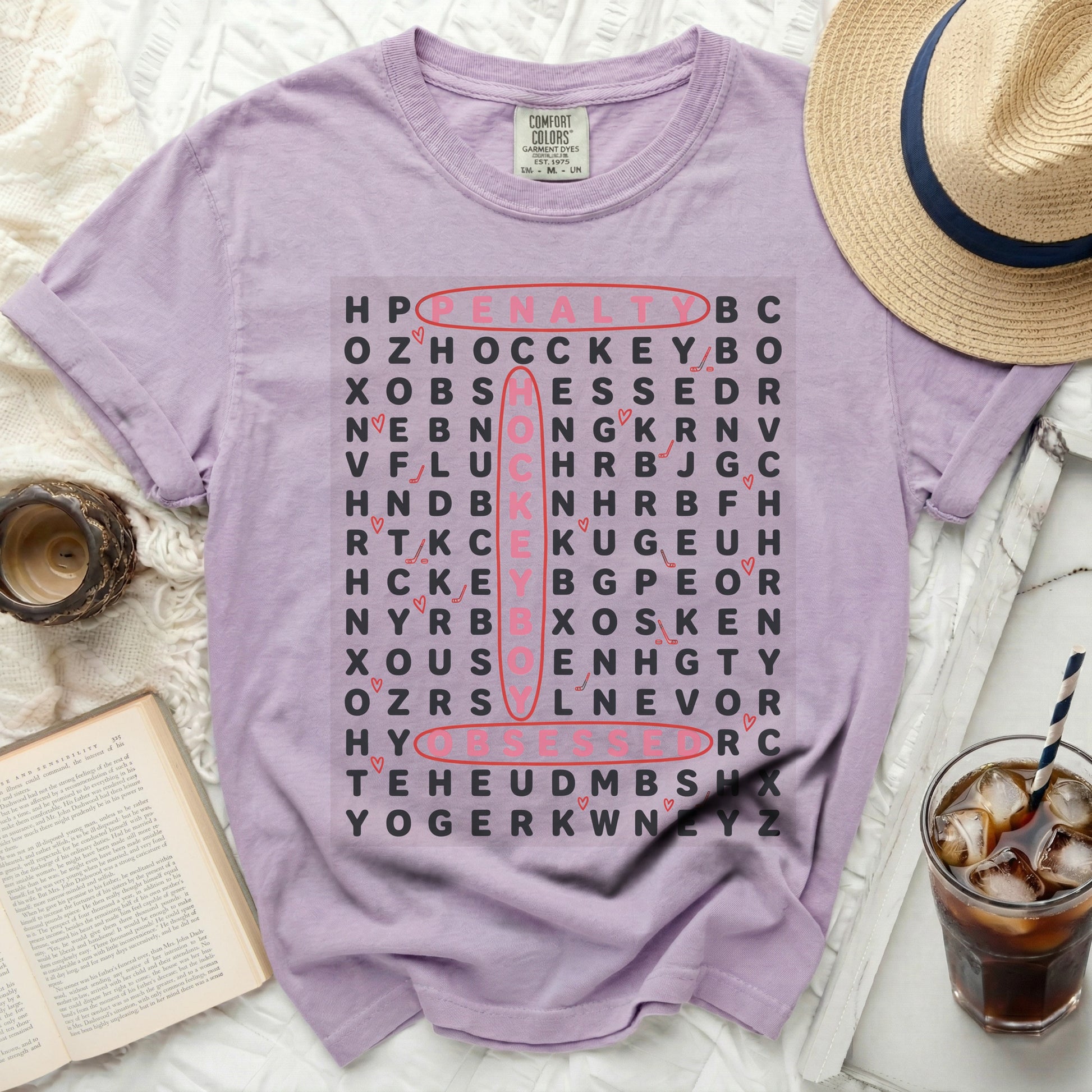 Purple Comfort Colors shirt with word search game featuring "penalty box" and "hockey".