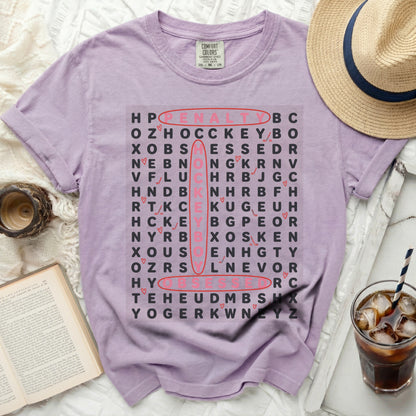 Purple Comfort Colors shirt with word search game featuring "penalty box" and "hockey".