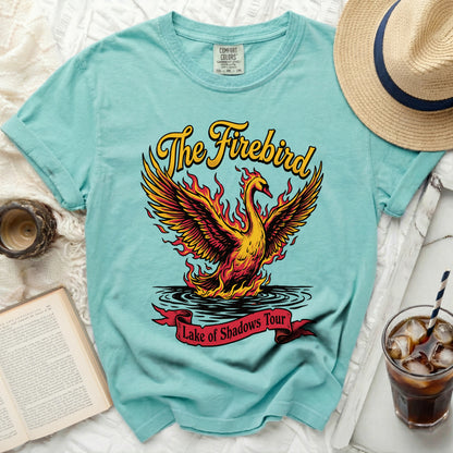Teal t-shirt with a flame bird and "The Firebird Lake of Shadows Tour" text.