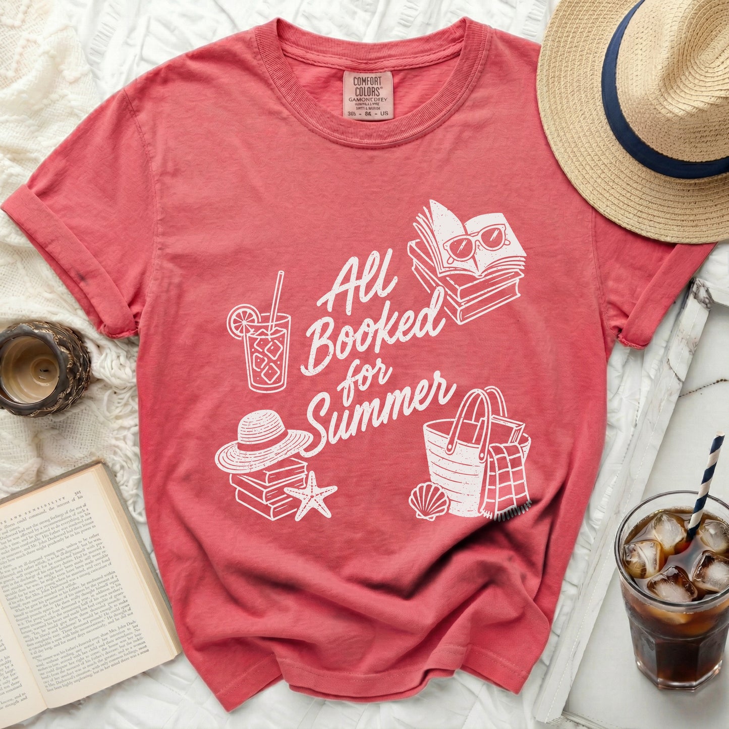 Red t-shirt with "All Booked for Summer" text and beach icons.