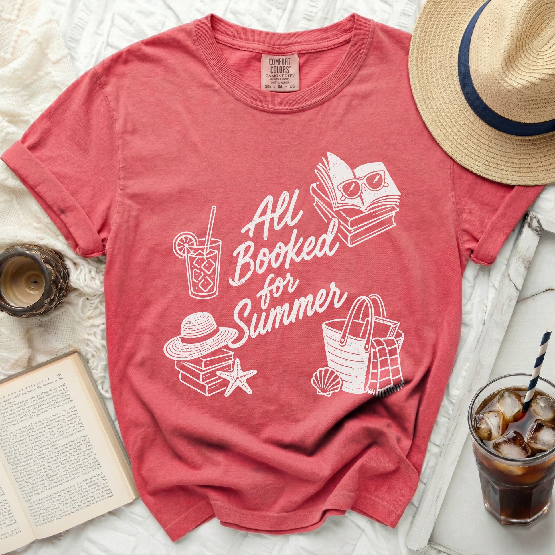 Red t-shirt with "All Booked for Summer" text and beach icons.