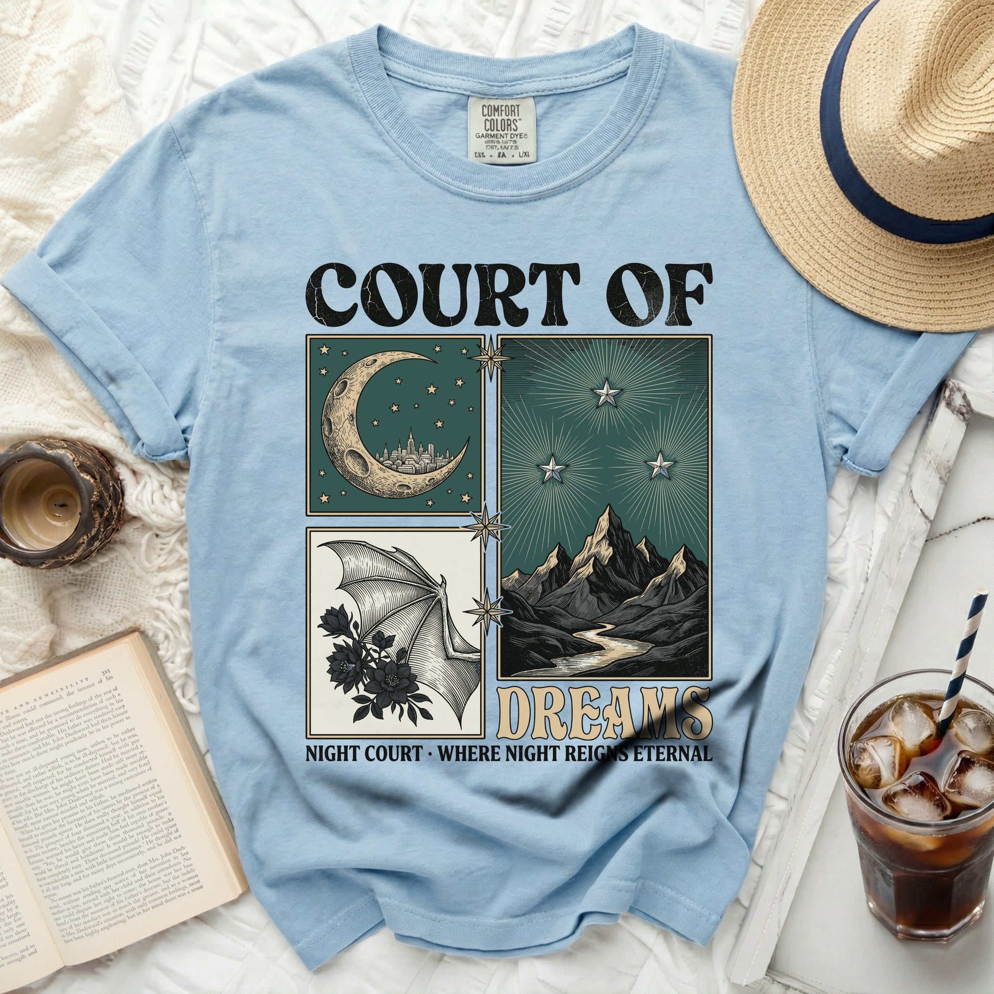 Court of Dreams shirt with moon, stars, bat wing, and mountains graphic.