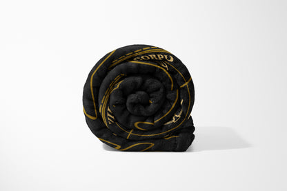 Luxurious Black and Gold Patterned Blanket
