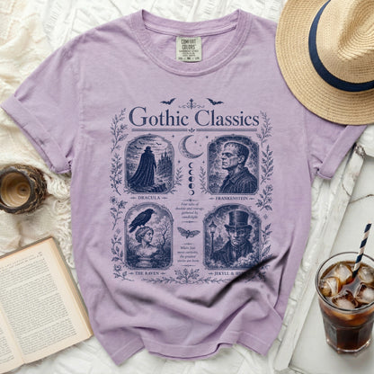 Purple t-shirt with "Gothic Classics" print featuring Dracula, Frankenstein, The Raven, and Jekyll & Hyde.