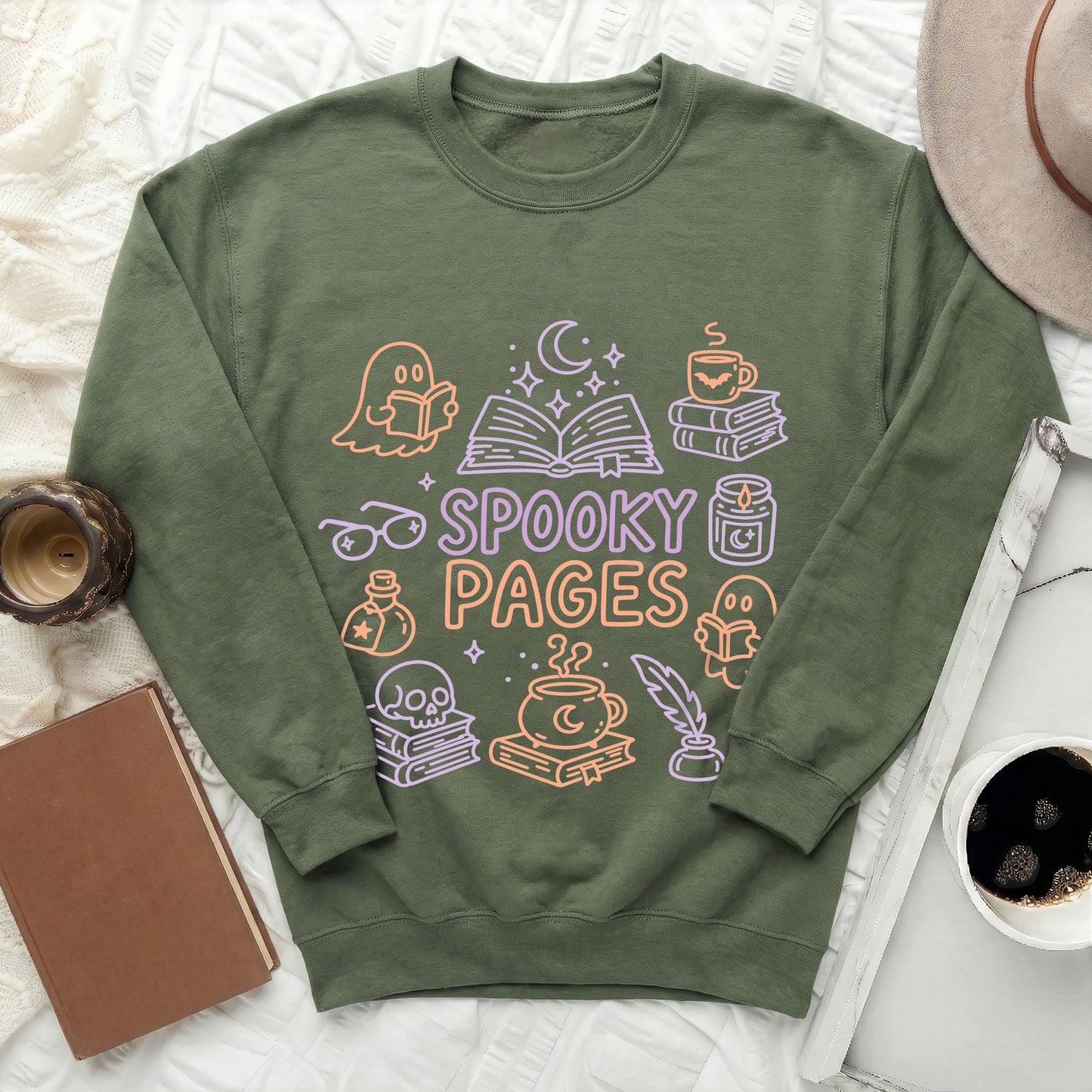 Green sweatshirt with "SPOOKY PAGES" and Halloween-themed book graphics.