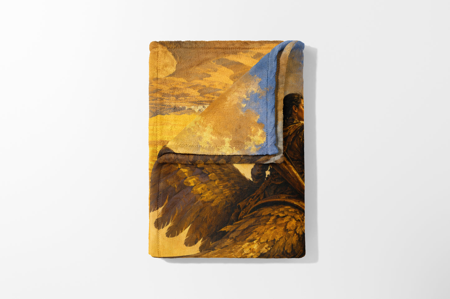 Towel with painting of a winged figure in a gold and blue sky scene.