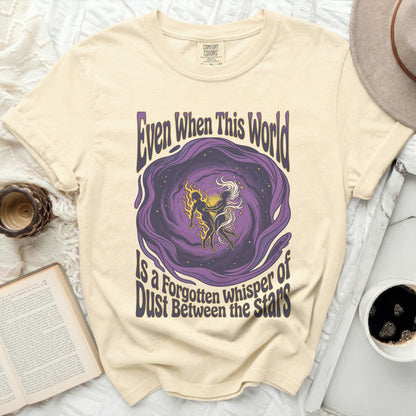T-shirt with purple cosmic swirl and text "Even When This World Is A Forgotten Whisper of Dust Between the Stars".