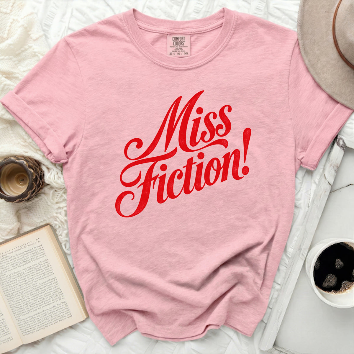 Pink comfort colors t-shirt with red "Miss Fiction!" graphic