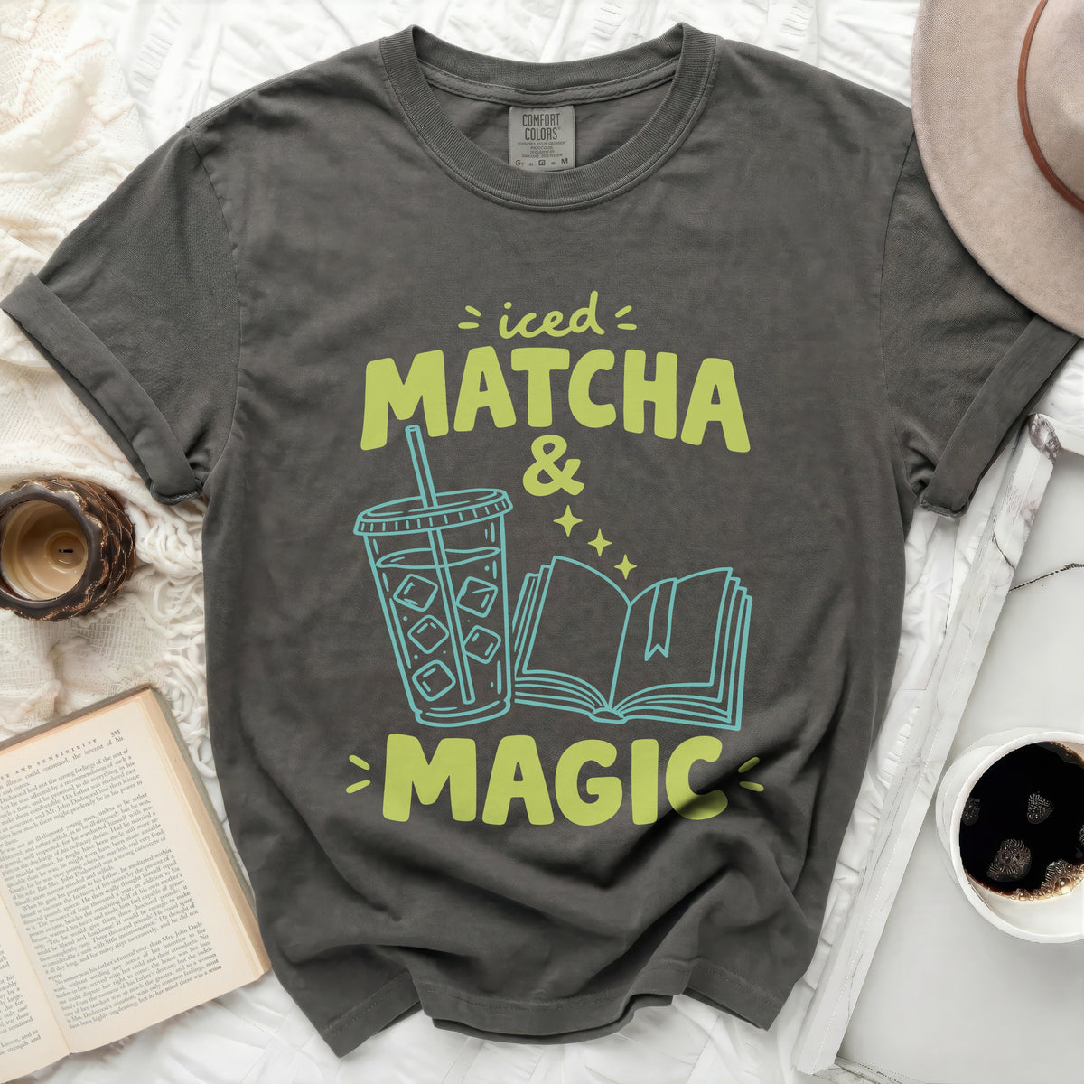 Iced Matcha & Magic graphic t-shirt with cup and book.