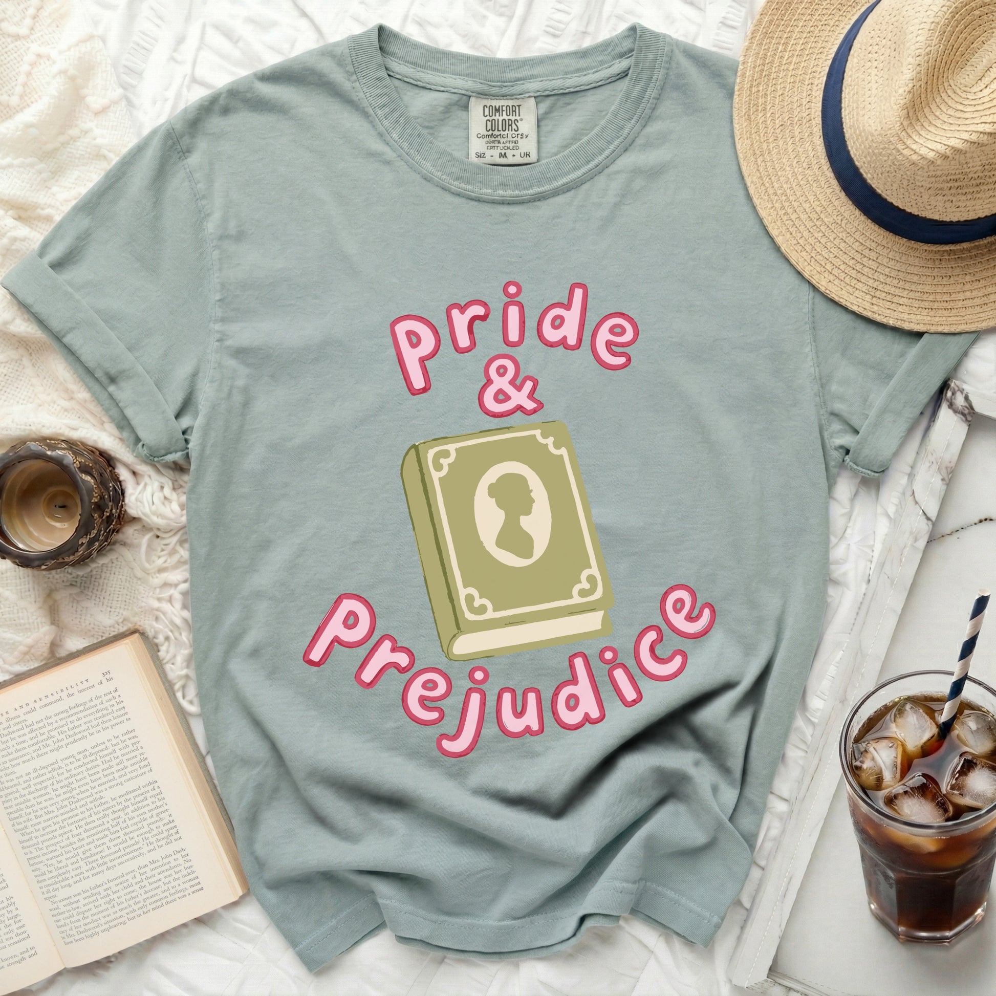 Green t-shirt with "Pride & Prejudice" text and book graphic.