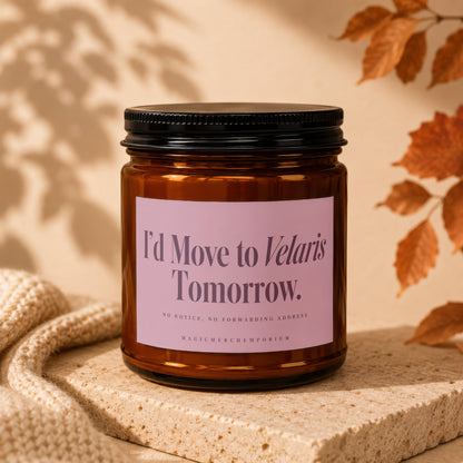 Amber candle in jar with pink label stating "I'd Move to Velaris Tomorrow."