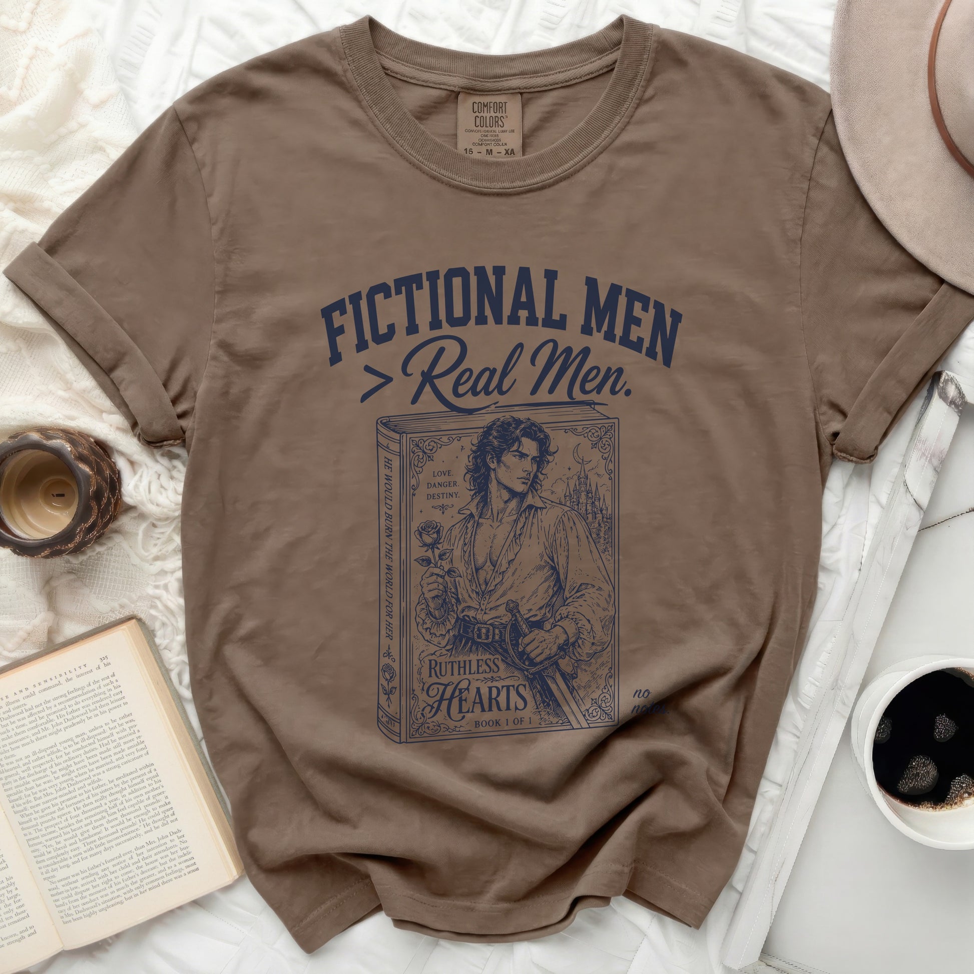 T-shirt with "Fictional Men > Real Men" and book-themed graphic.