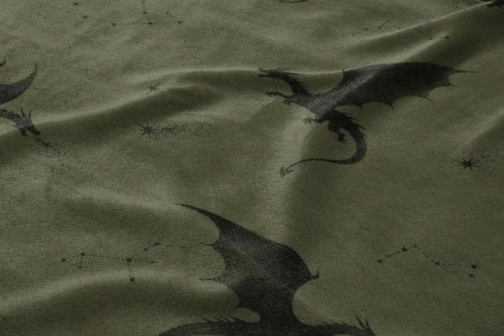 Dark green fabric with a pattern of black dragons and scattered constellations.