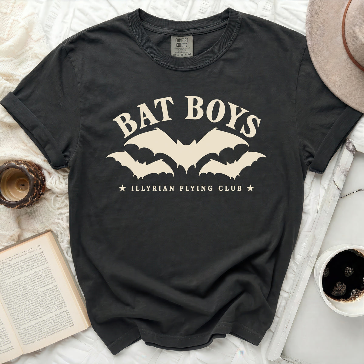 Dark t-shirt with cream text "BAT BOYS ILLYRIAN FLYING CLUB" and bat graphics.