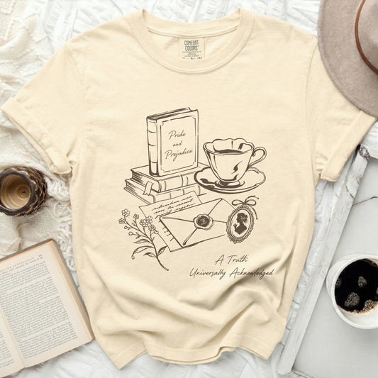 Cream t-shirt with sketch of book, teacup, envelope, and cameo, "Pride and Prejudice" text.