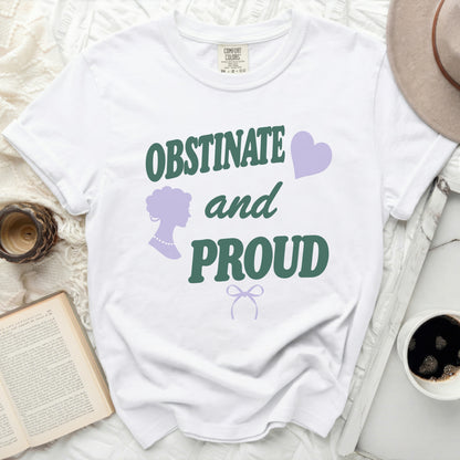White t-shirt with "OBSTINATE and PROUD" text and purple graphics.