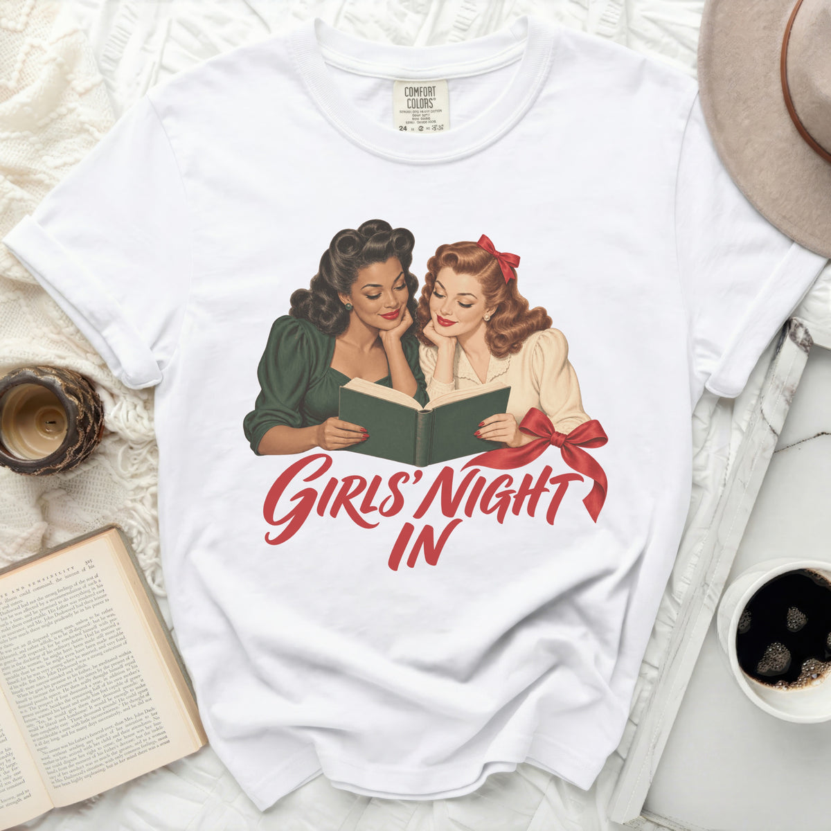 White t-shirt with vintage illustration of two women reading and the text "Girls' Night In".