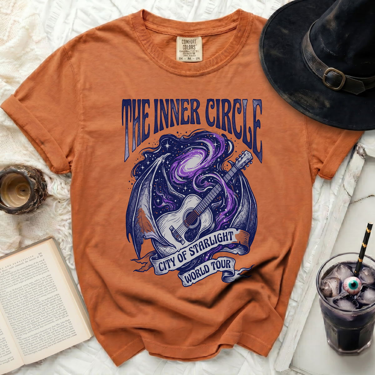 Orange t-shirt with "The Inner Circle City of Starlight World Tour" graphic.