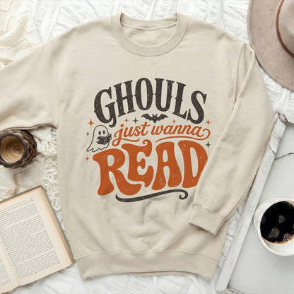 Cream sweatshirt with "Ghouls just wanna READ" text and ghost graphic.