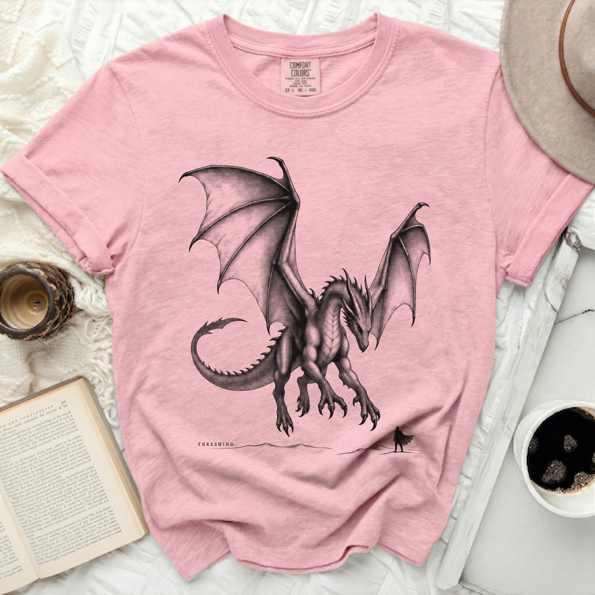 Pink t-shirt with a black dragon graphic and "THRESHING" text.
