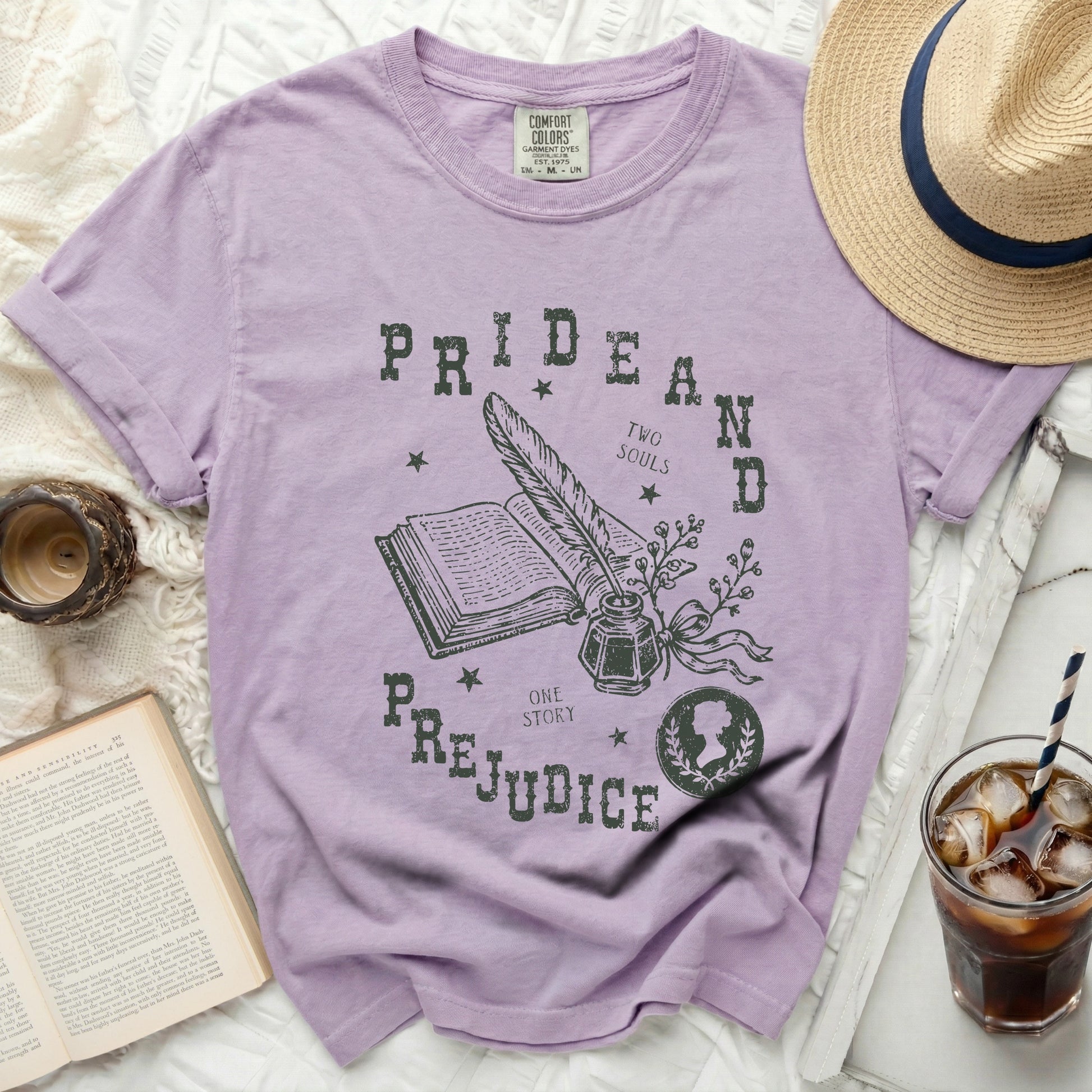 Lilac t-shirt with "Pride and Prejudice" text and literary graphics.
