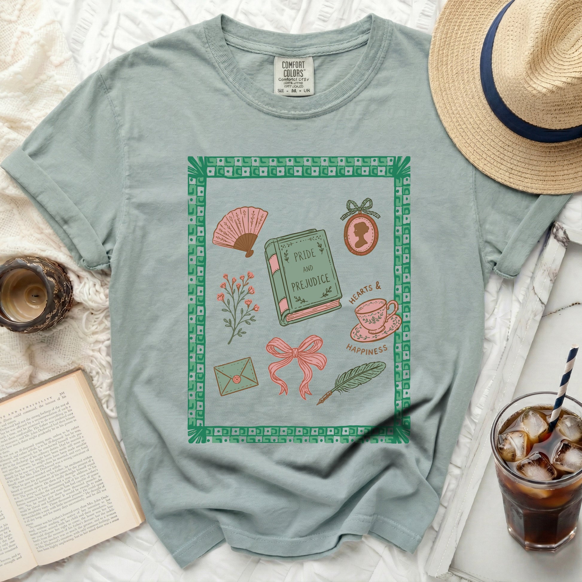 Light blue t-shirt with "Pride and Prejudice" book and related illustrations.