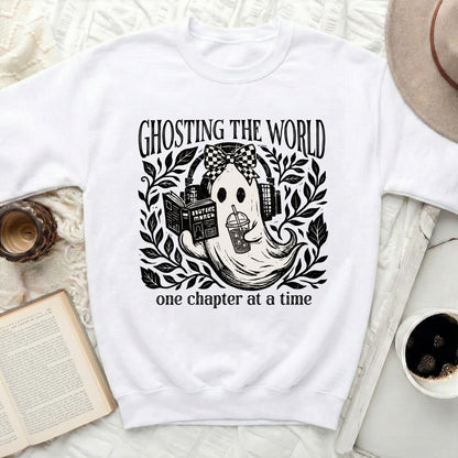 Ghosting the world, one chapter at a time graphic on a white sweatshirt.
