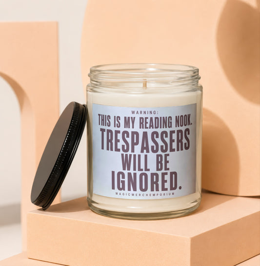Glass candle with black lid features text: "WARNING: THIS IS MY READING NOOK. TRESPASSERS WILL BE IGNORED."