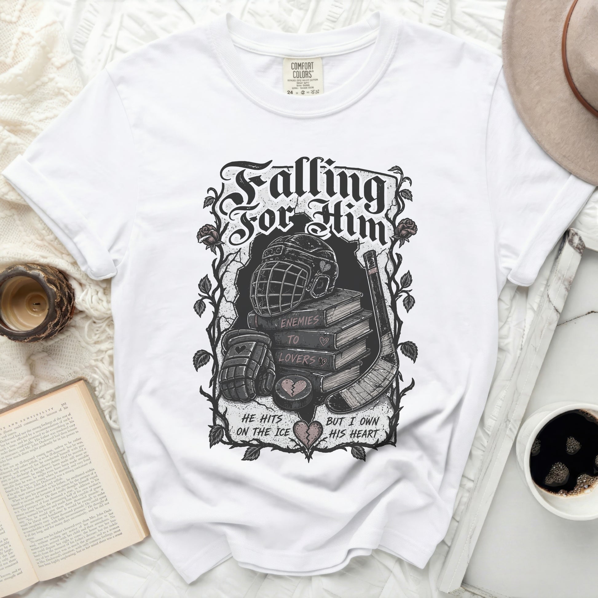 White t-shirt with "Falling For Him" graphic and hockey imagery.
