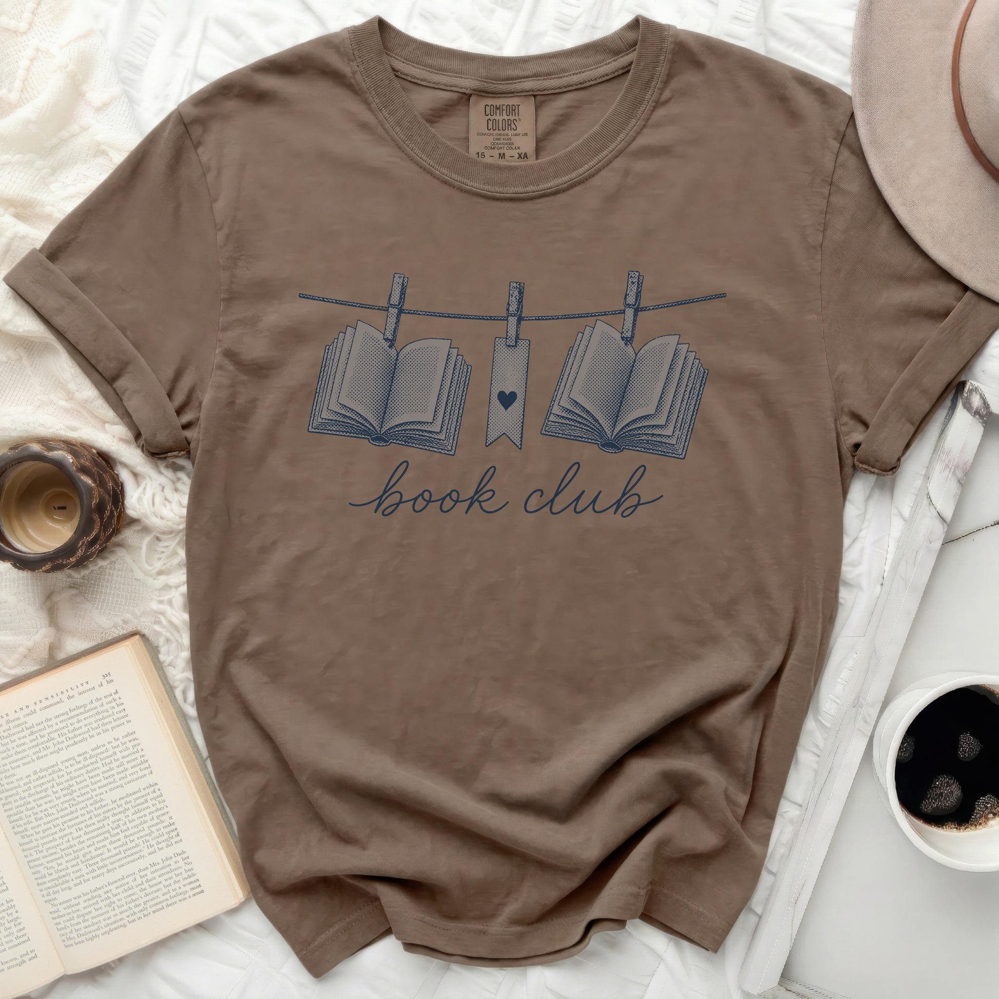 Brown t-shirt with "book club" text and hanging books graphic.