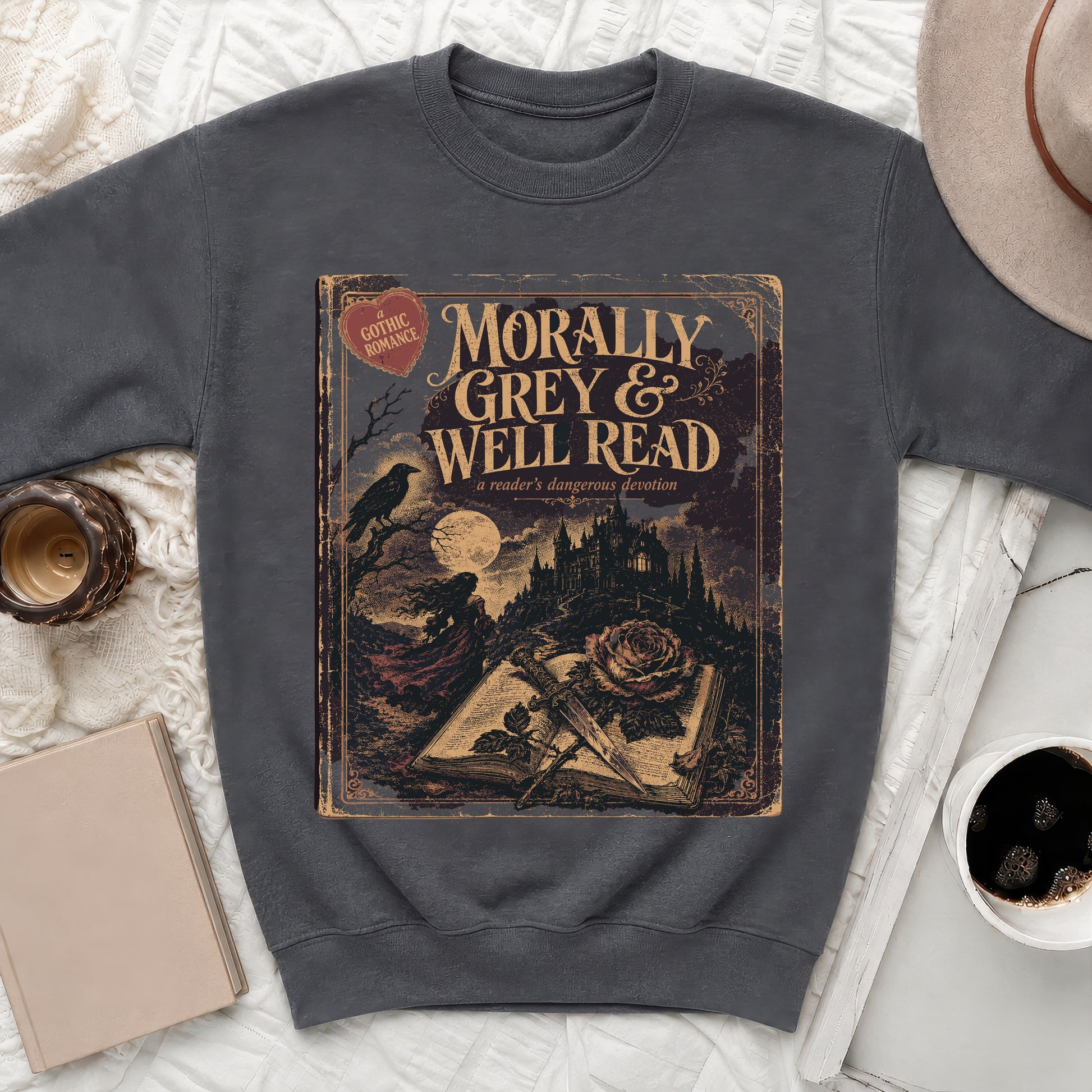 Crewneck sweatshirt with "Morally Grey & Well Read" book graphic and gothic romance theme.
