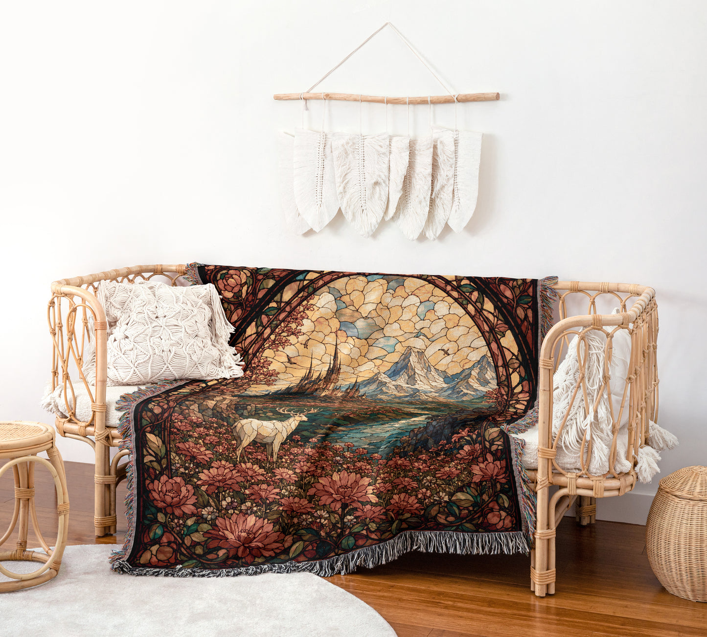 a cozy living space with a woven bench, a colorful woven blanket, and a wall hanging with white feathers.