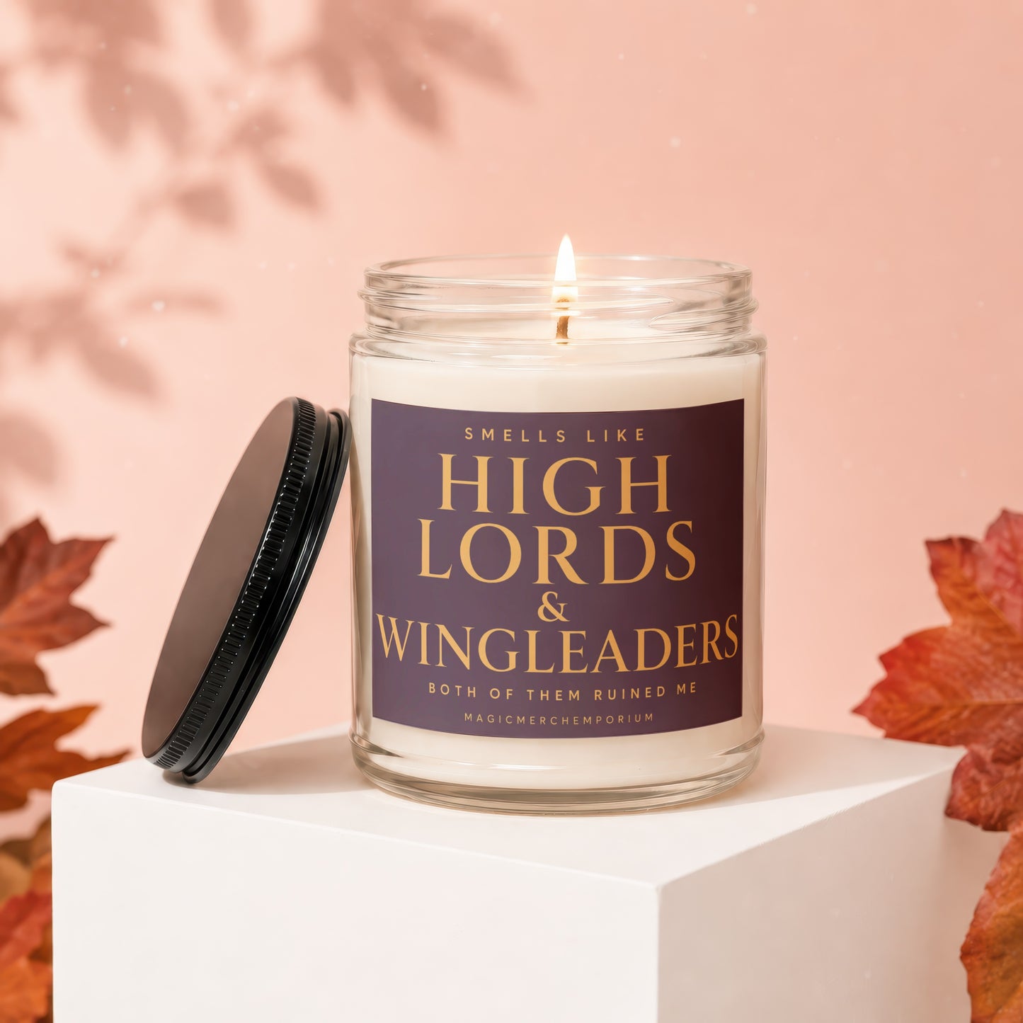 Lit candle with label "Smells like High Lords & Wingleaders".