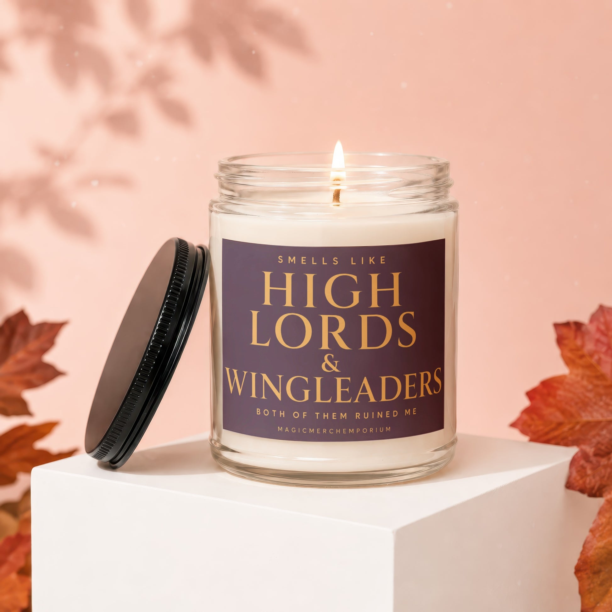 Lit candle with label "Smells like High Lords & Wingleaders".